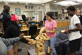  Students playing Jenga and the tower is falling